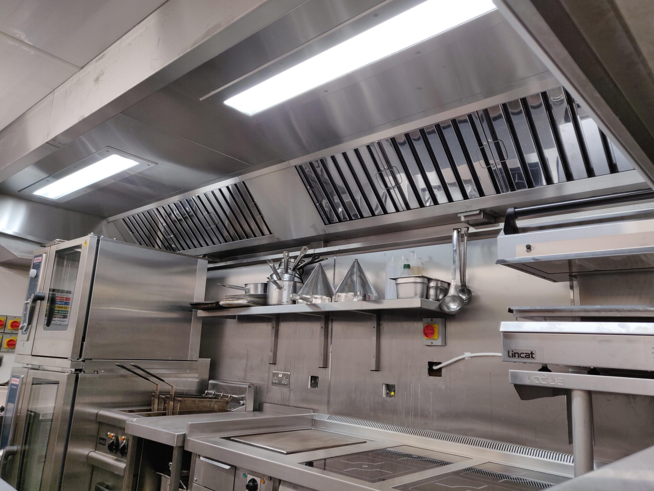 Commercial kitchen canopy and ventilation system installed in a professional London kitchen.